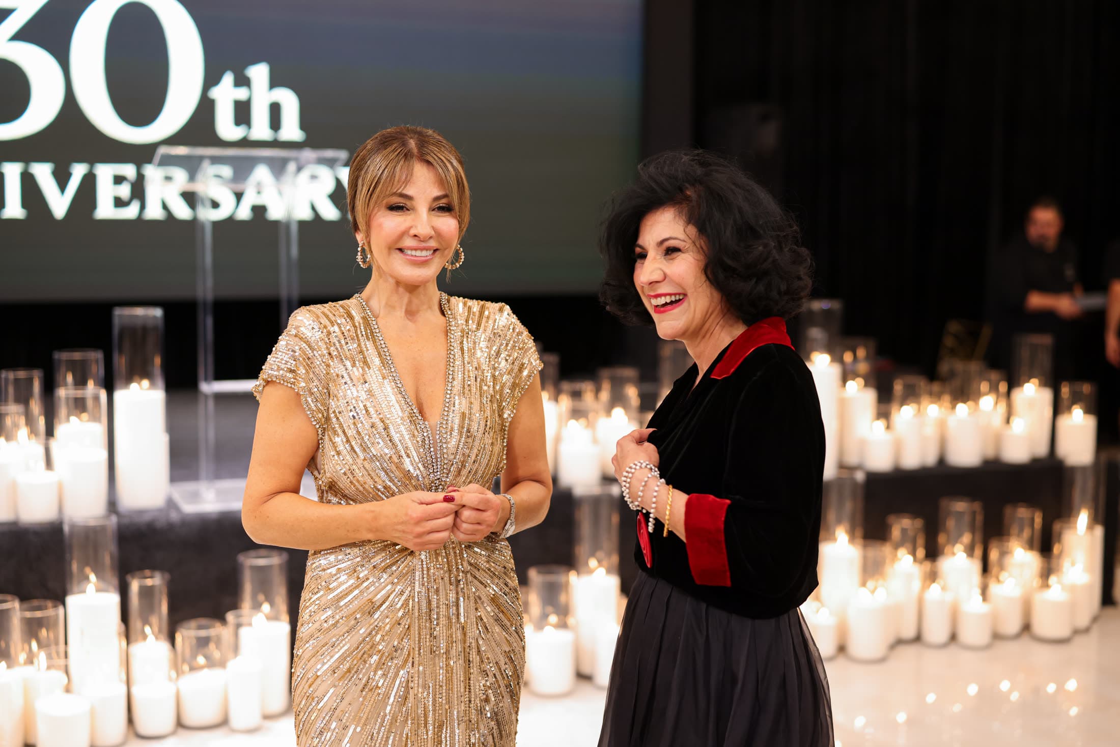 Maro with her mentor beside the candle wall